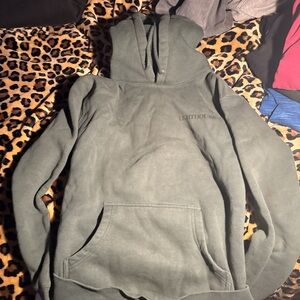 A green lighthouse hoodie,